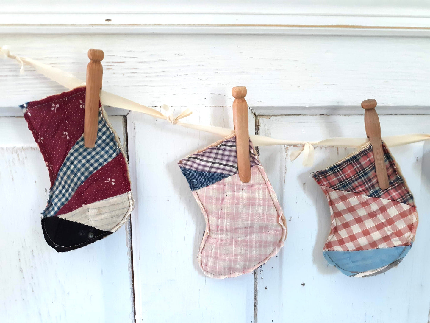 Antique Quilt Stocking Ornaments, Wooden Clothes Pegs, and Knotted Cloth Hanger