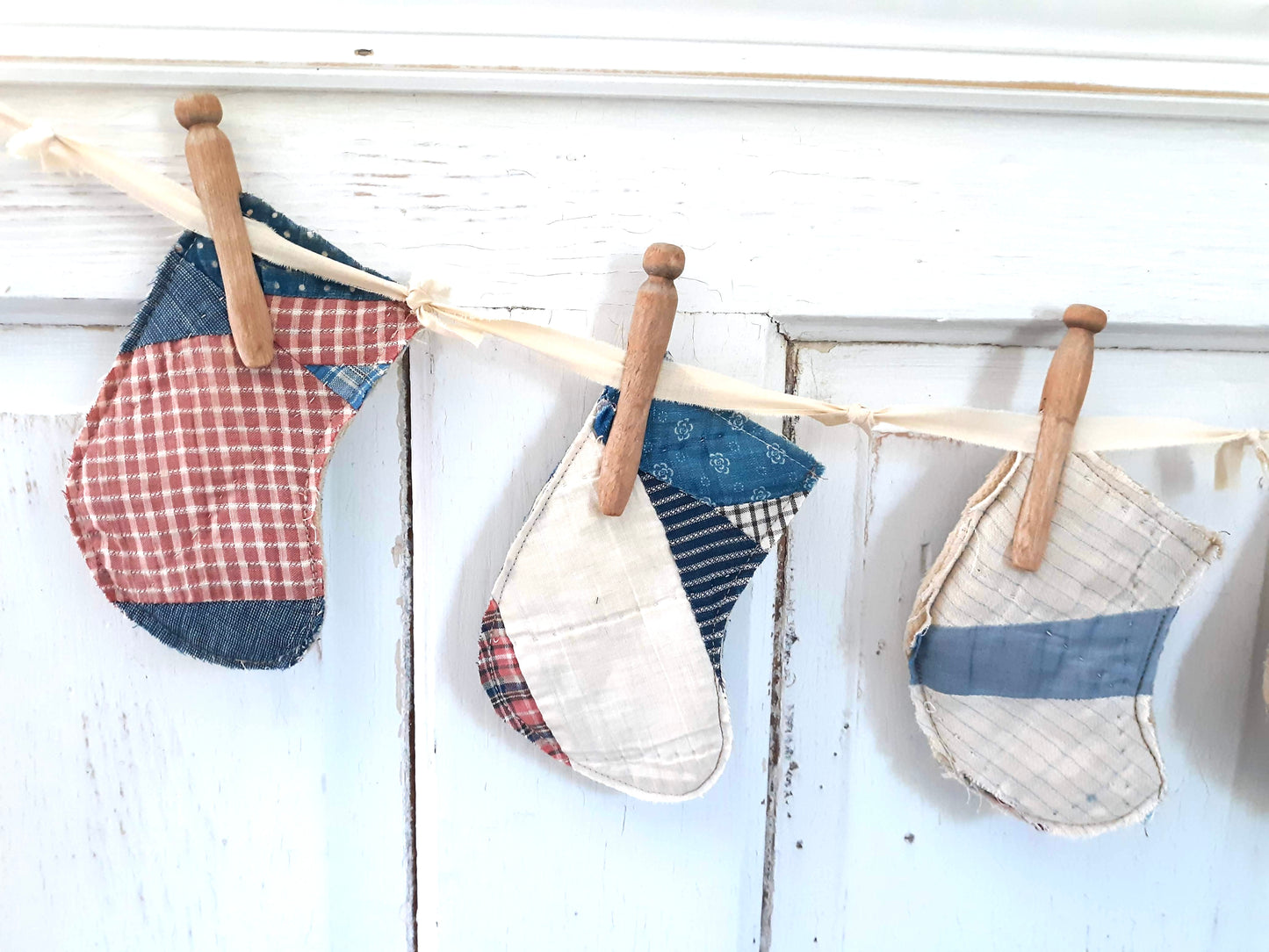 Antique Quilt Stocking Ornaments, Wooden Clothes Pegs, and Knotted Cloth Hanger
