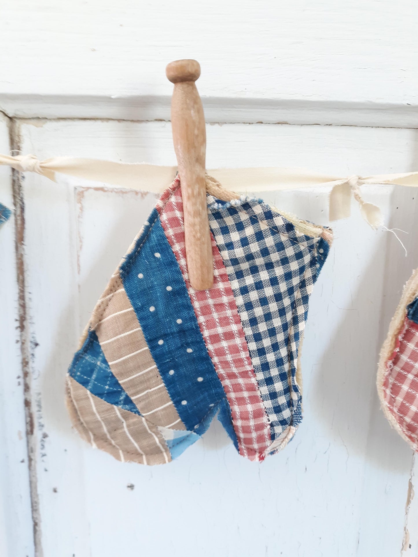 Antique Quilt Stocking Ornaments, Wooden Clothes Pegs, and Knotted Cloth Hanger