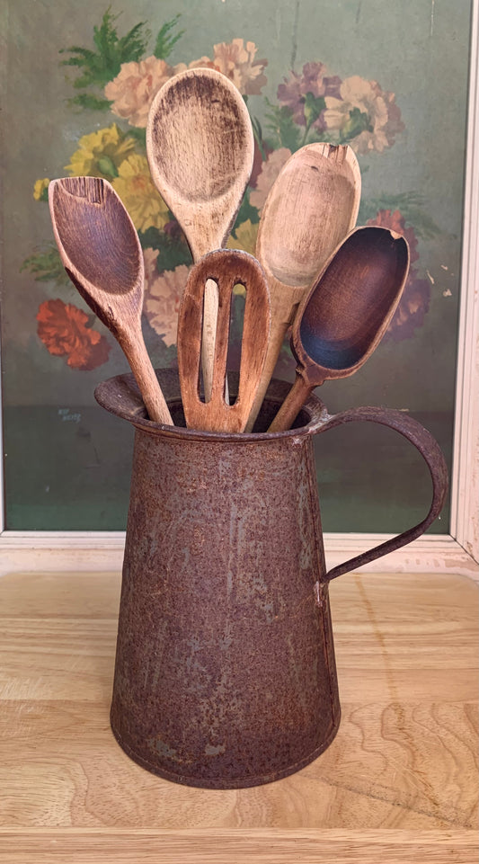 Rusty Pitcher with 5 Wooden Spoons