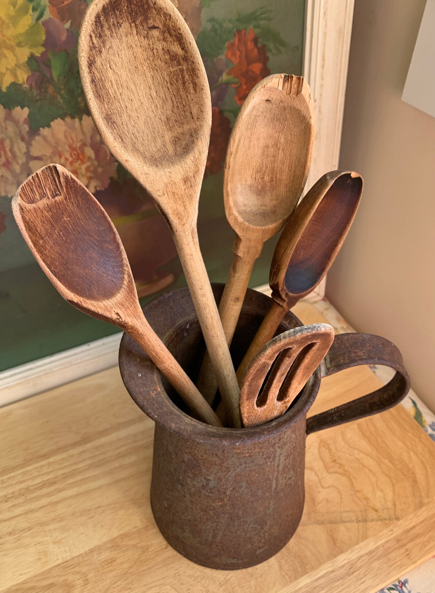 Rusty Pitcher with 5 Wooden Spoons